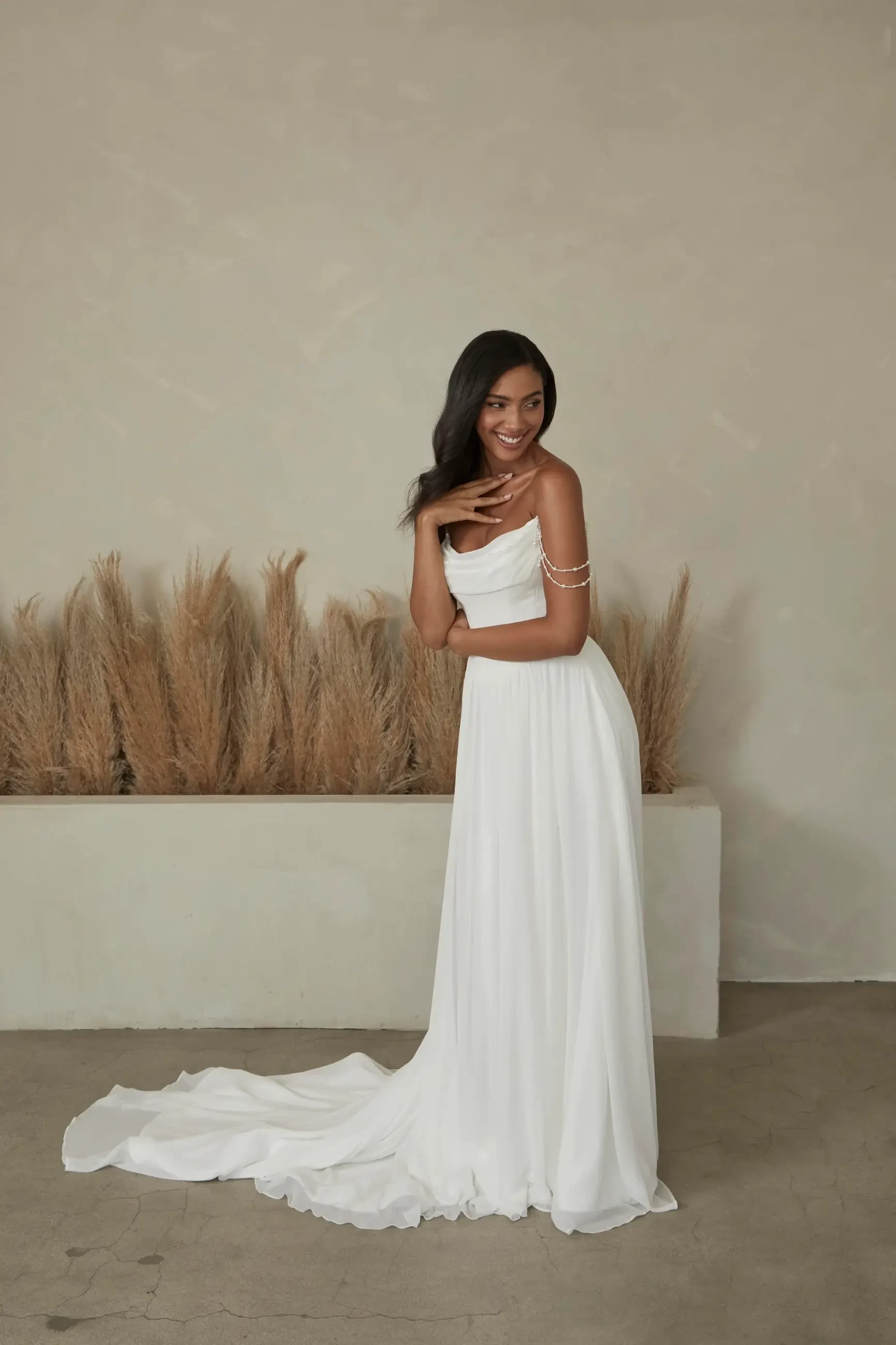 model is wearing a strapless a-line wedding dress